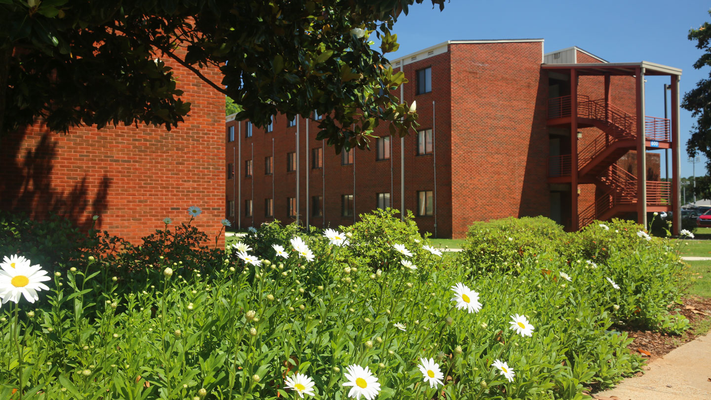 the exterior and landscaping of southeast campus hall at uah