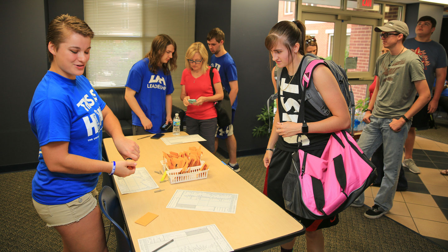 college students moving into dormitory at UAH