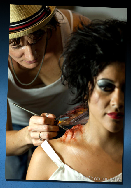 Michele Mulkey applies moulage makeup to actress Laura Montes. 