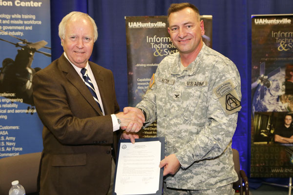 UAHuntsville President Dr. Robert Altenkirch and Col. Timothy Baxter signed a an agreement to explore opportunities for collaboration to promote the development of the next generation of Unmanned Aircraft Systems.Tuesday, April 16, 2013. Baxter is the Program Manager for Unmanned Aircraft Systems.
