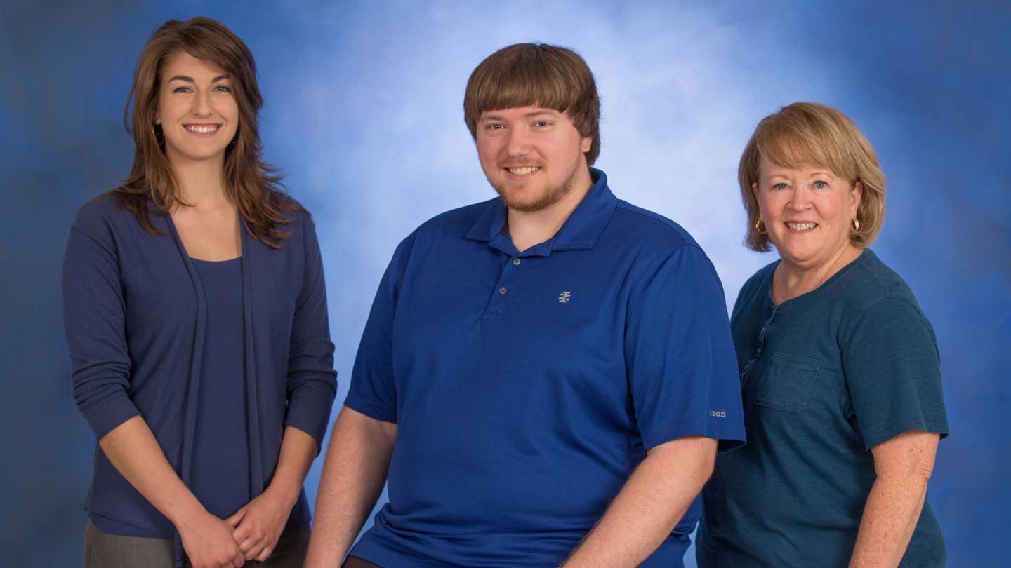 Alex Sims, president of the iSystems Club; Josh Deaton, vice president for projects of the iSystems Club; and Carolyn Rhodes, fitness coordinator at the Huntsville-Madison County Senior Center.