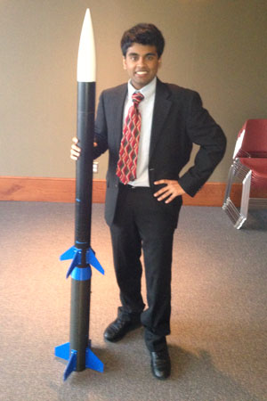 Charger Rocket Works’ program manager Amit Patel with the team’s rocket.