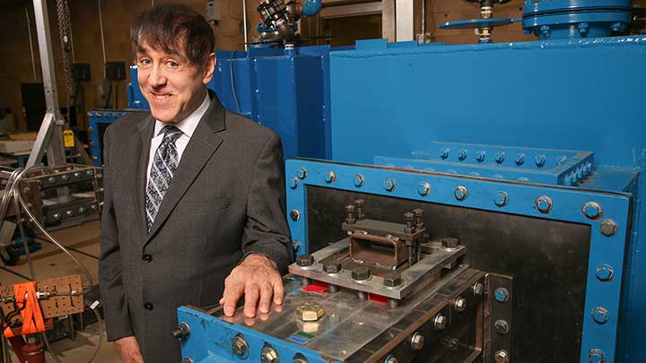 Phillip Ligrani in a lab with equipment.
