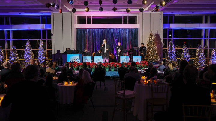 Dr. Joshua Burel, chair of The University of Alabama in Huntsville Department of Music, Theatre and Film and associate professor of music theory and composition, welcomes guests to the third annual Holiday Jazz event on Dec. 10, 2024