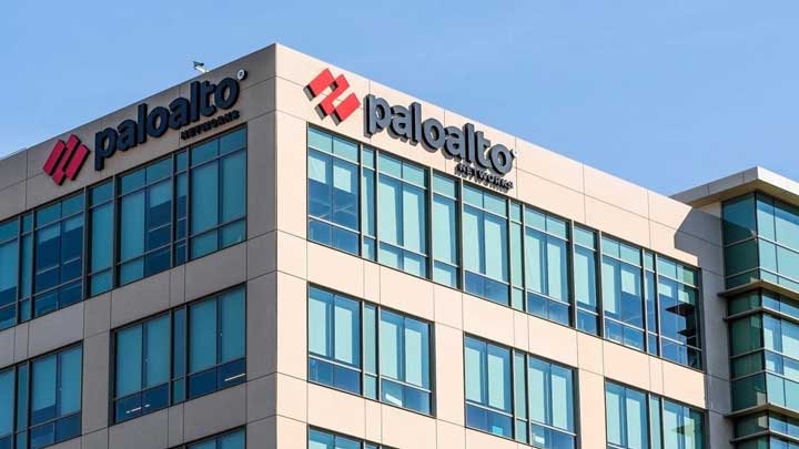 Office building with Palo Alto Networks logo on the corner under a clear blue sky.
