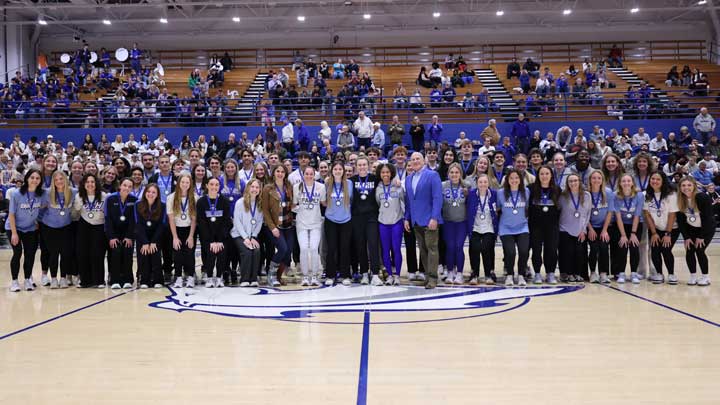 Student-athletes at The University of Alabama in Huntsville (UAH) who earned a 4.0 grade point average during the spring or fall 2024 semester gather at center court with UAH President Dr. Charles Karr for the annual 4.0 Night celebration.