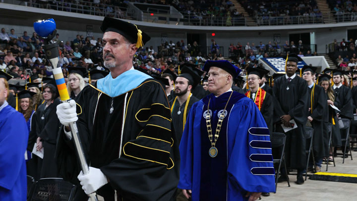 The University of Alabama in Huntsville spring commencement ceremonies on May 6, 2024, carried by Dr. David Kyle clinical assistant professor, kinesiology. UAH President Dr. Charles L. Karr follows