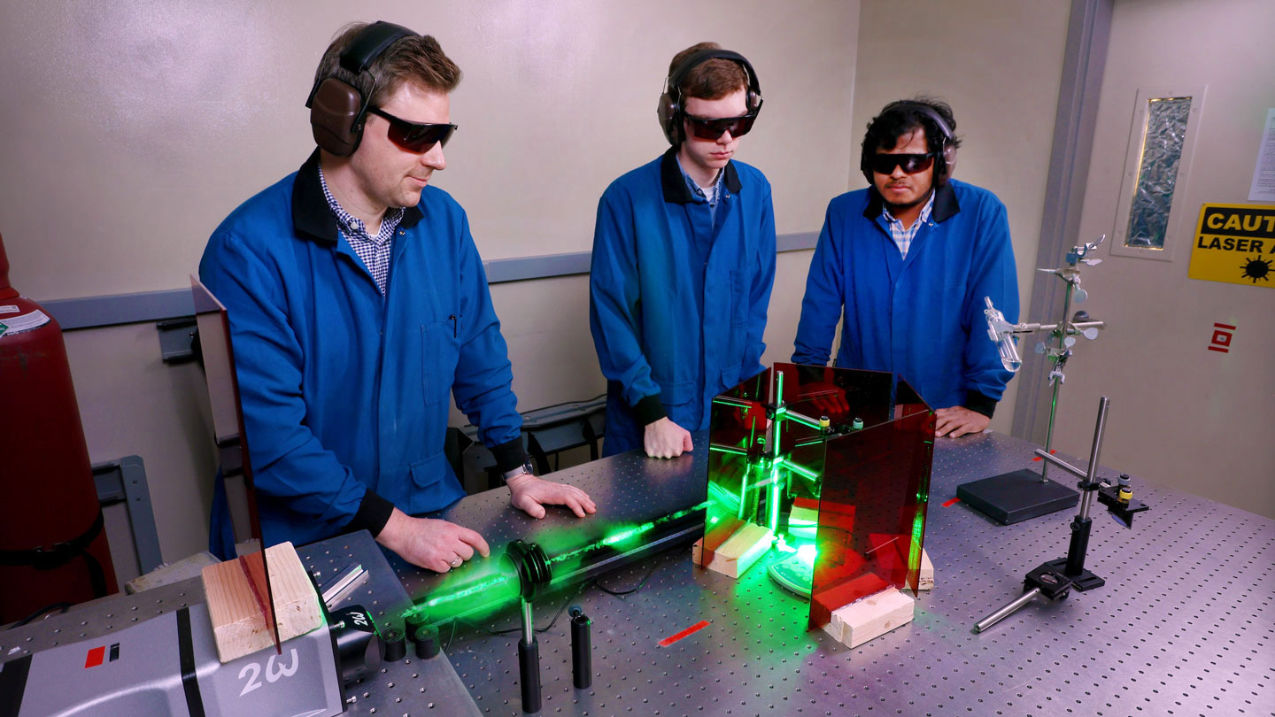 Students conduct a laser experiment