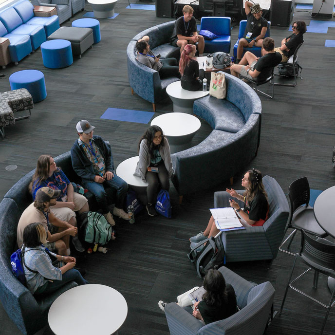 a new group of UAH students sitting in a circle
