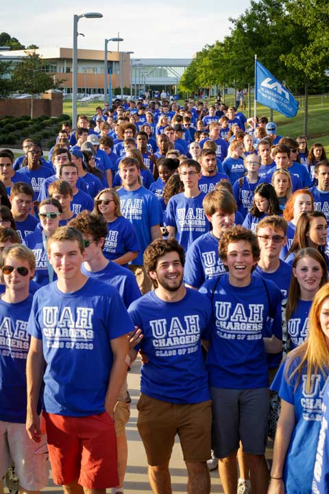 Large gathering of UAH students standing on the greenway