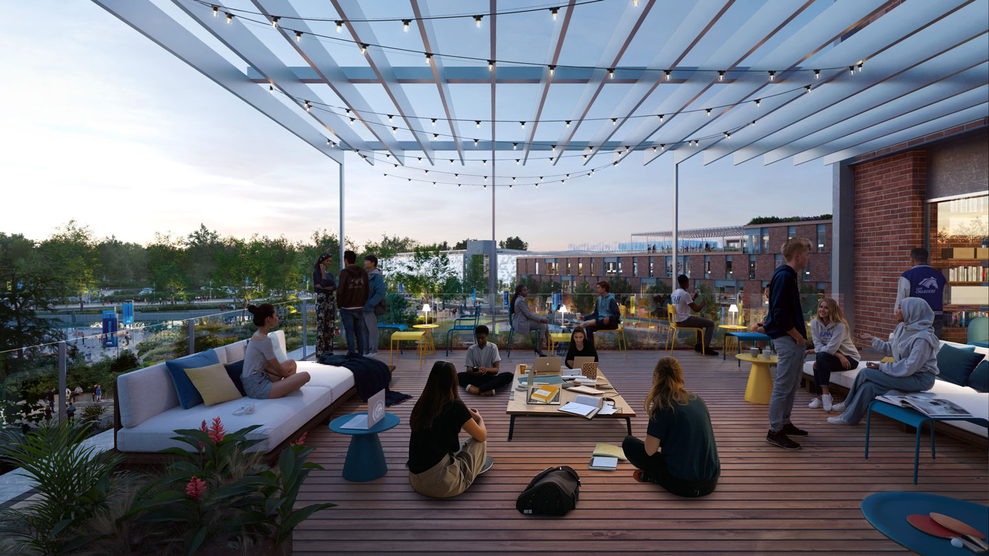 Students sitting on outdoor furniture under a pergola on the rooftop patio of a new dormitory.