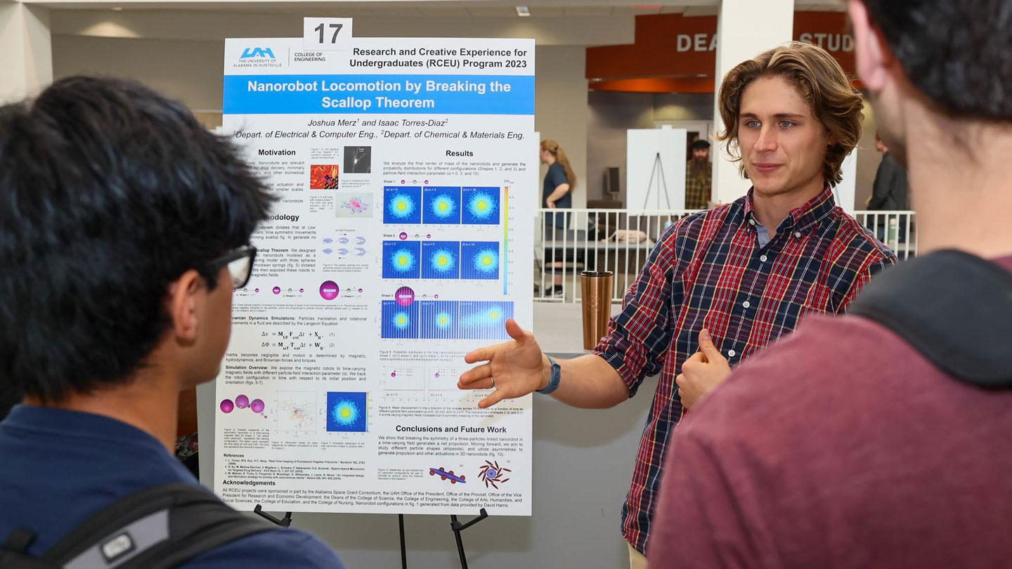 a U A H engineering student presents research results to peers