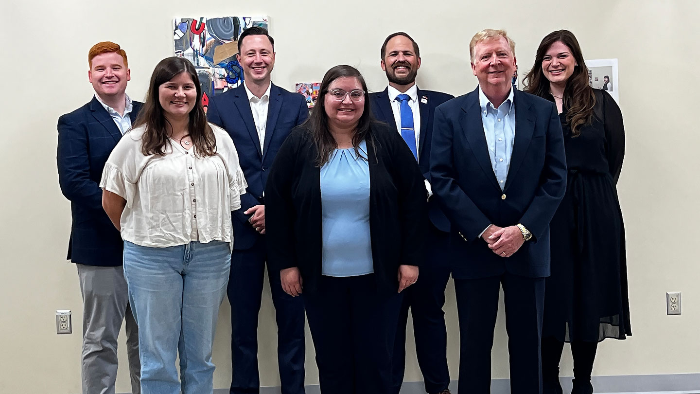 Alumni Board of Directors standing in a group photo.