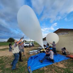 members-filling-balloon-in-high-winds101423