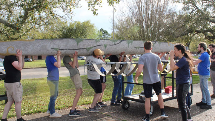 UAH engineering students racing a concrete canoe on the Bayou St. John in the 37th annual American Society of Civil Engineers