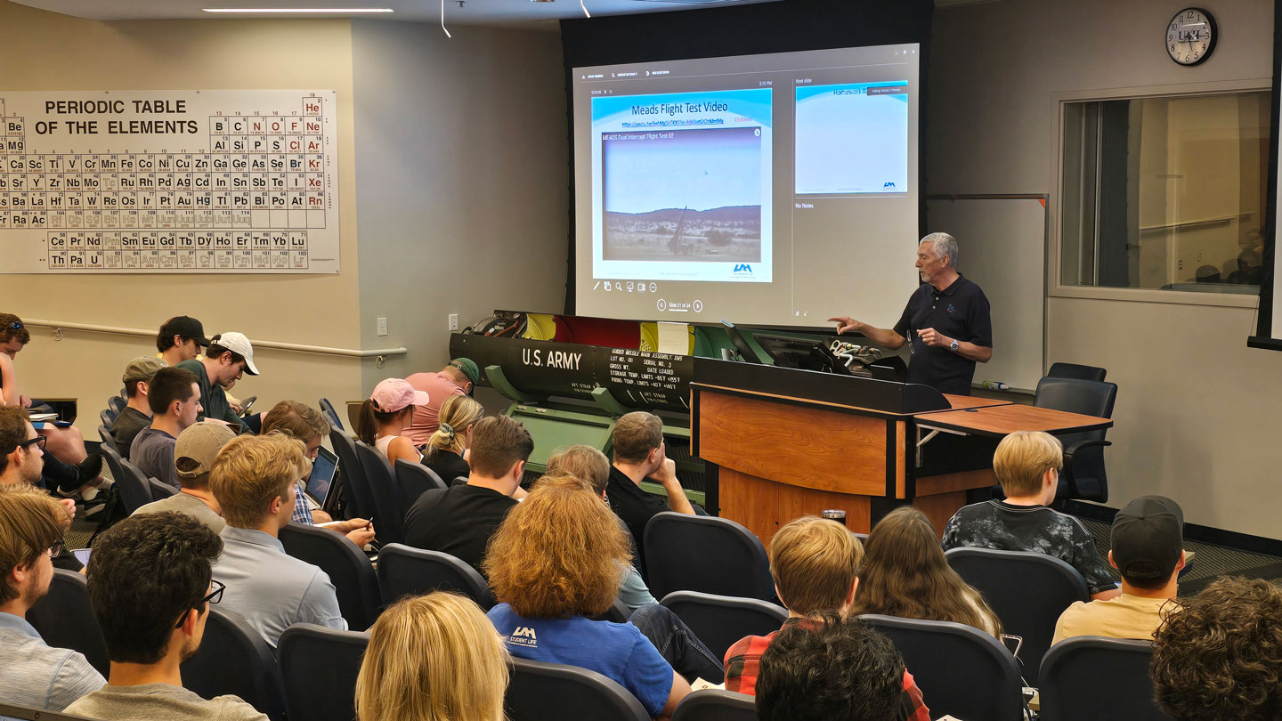 John Troy, co-founder of Troy7, Inc., explains the inner workings of the Lance missile to a new semester of UAH students.