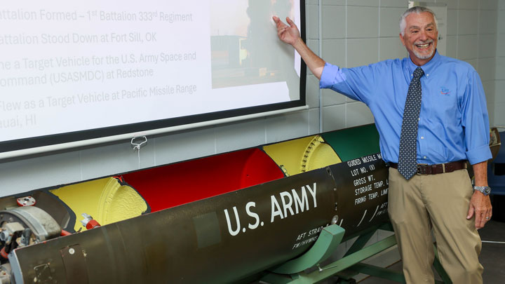 John Troy, co-founder of Troy7, Inc., shows off Lance missile cutaway displayed in its new home at the UAH Propulsion Research Center.