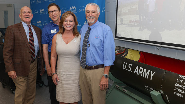 UAH President, Charles L. Karr; Dr. Robert Frederick, director, UAH Propulsion Research Center; UAH alumna Lynn Troy, president, Troy7, Inc.; UAH alumnus John Troy, co-founder of Troy7, Inc.