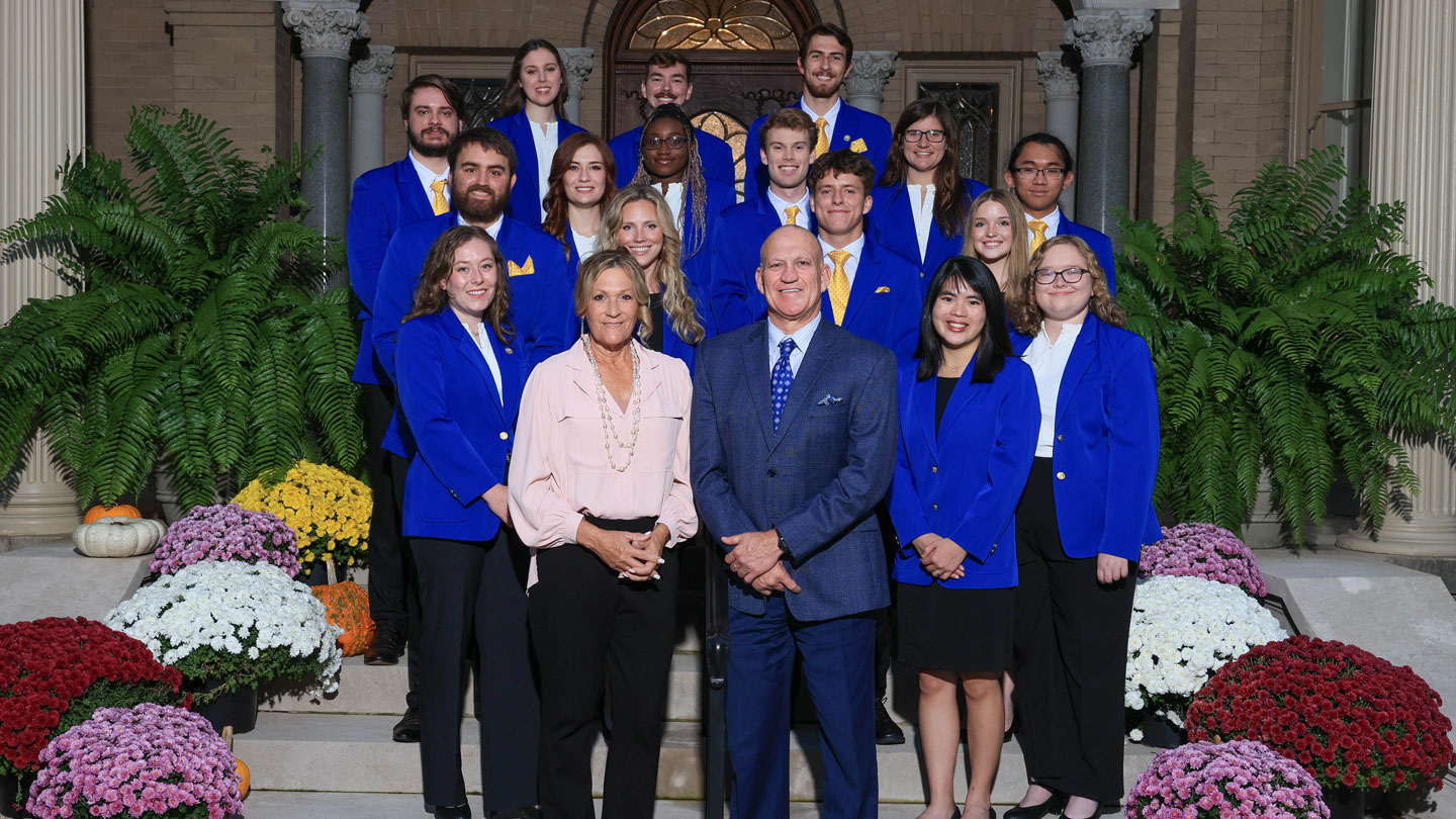 The University of Alabama in Huntsville Lancers join UAH President Dr. Charles L. Karr, center right, and his wife, Jodie, center left, at Lowe House, Lancer Yanjie Horton stands to Karr’s immediate right.