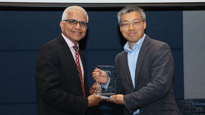 Dean Shankar Mahalingham, College of Engineering, presents Outstanding Faculty Award to Dr. Guangsheng Zhang
