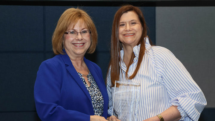 Dean Karen Frith, College of Nursing, presents Outstanding Faculty Award to Dr. Donna Guerra