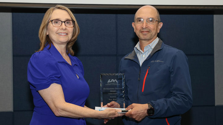 Dr. Terri Johnson, College of Science, presents Outstanding Faculty Award to Dr. Paul Wolf